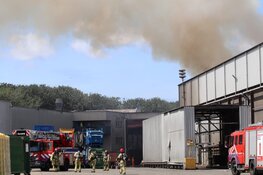 Brandend afval Amsterdam te zien in de wijde omtrek