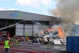 Brandend afval Amsterdam te zien in de wijde omtrek