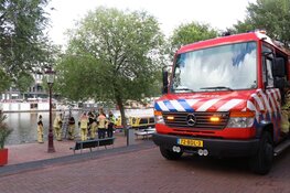 Vrouw uit water Herengracht gehaald