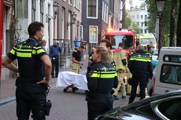 Vrouw uit water Herengracht gehaald
