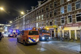 Brand in meterkast Albert Cuypstraat Amsterdam, zeven mensen ademen rook in