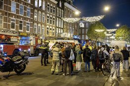Brand in meterkast Albert Cuypstraat Amsterdam, zeven mensen ademen rook in