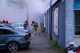 Brand bij garagebedrijf in Amsterdam