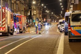 Brand in grachtenpand in Amsterdam