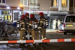 Meerdere woningen ontruimd bij grote brand fietsenwinkel Amsterdam
