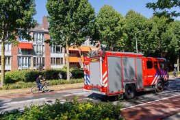 Brandweer voorkomt overslag naar woning bij brand in Amsterdam